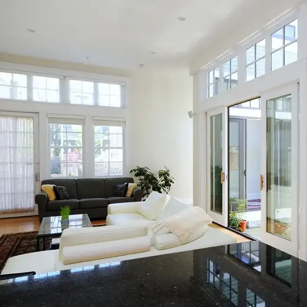 home interior with multiple windows, sliding door and entry way