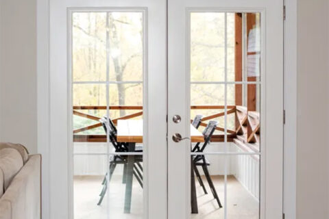 White glass patio doors opening to a porch
