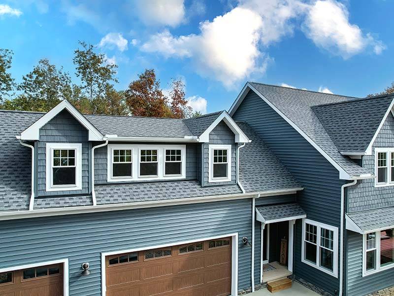 House Exterior with Modern Grey Roofing and Clean Siding 