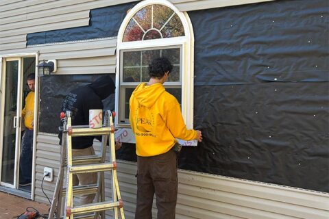 Staff working on window slider.