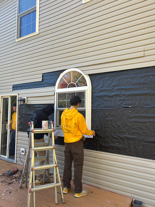 Staff working on window slider.